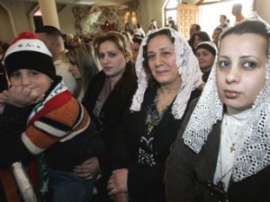 Iraqi women at a church worship.